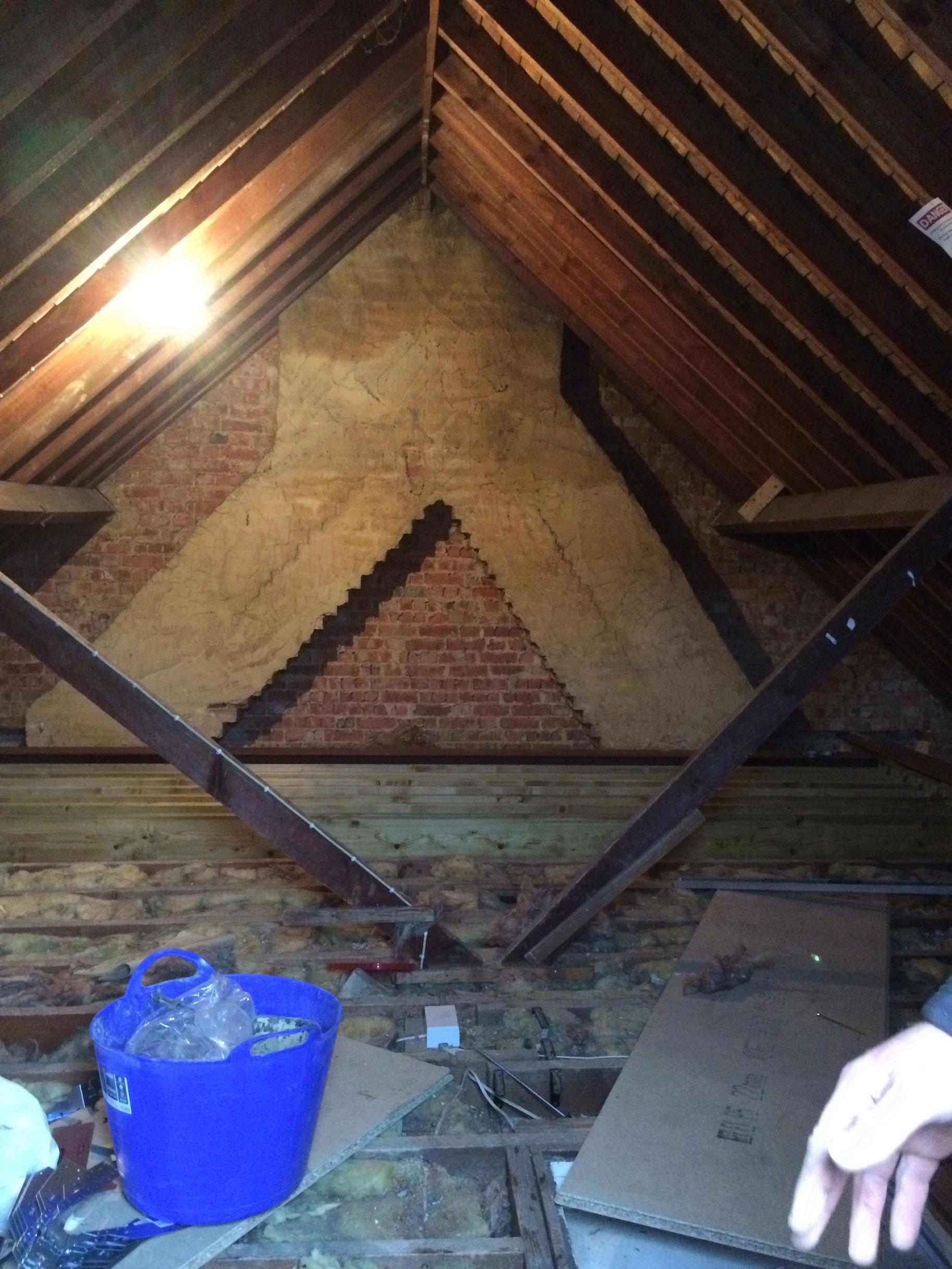 Within the attic there was a double converging chimney and two king