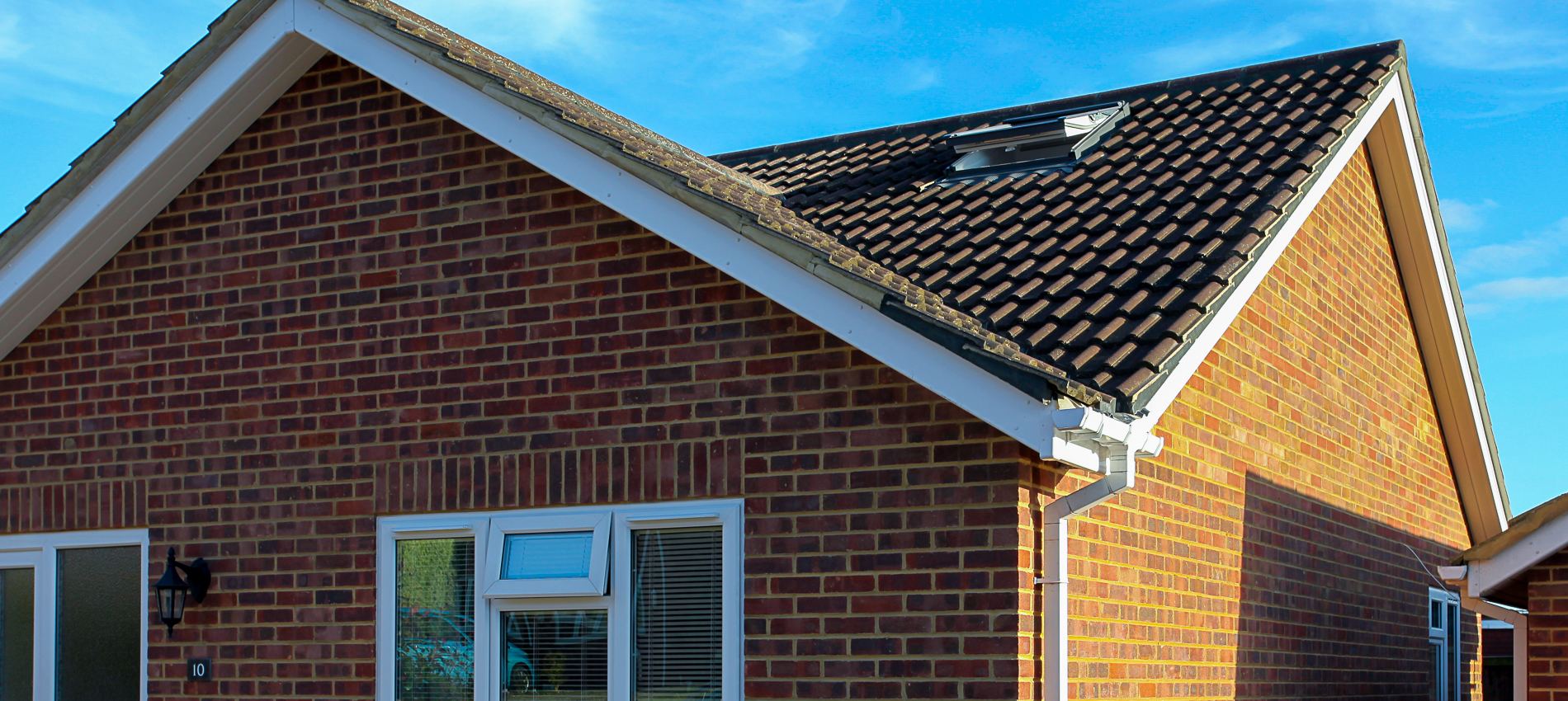 two gable roofs with a hip roof